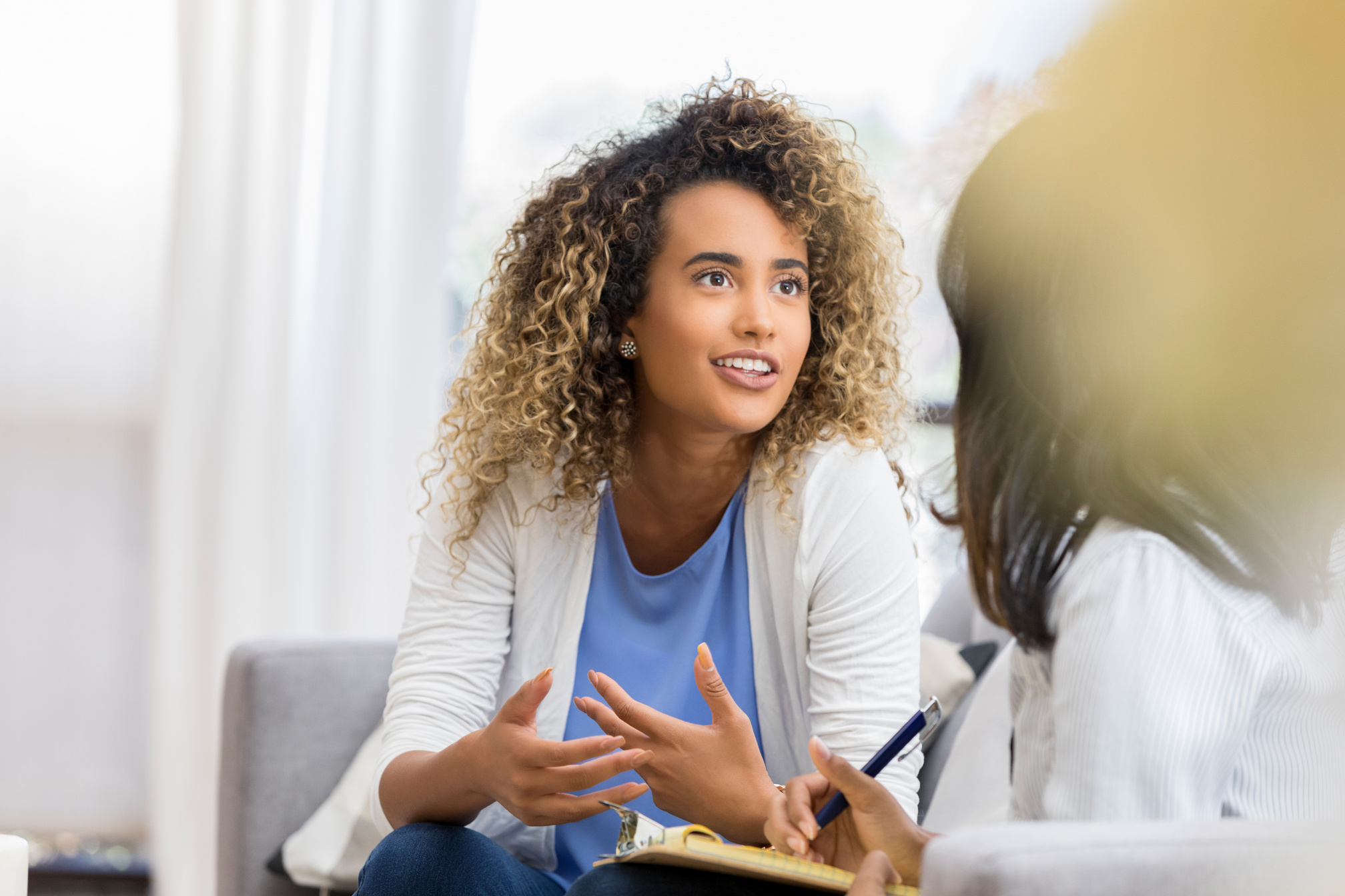 Woman talking with mental health professional